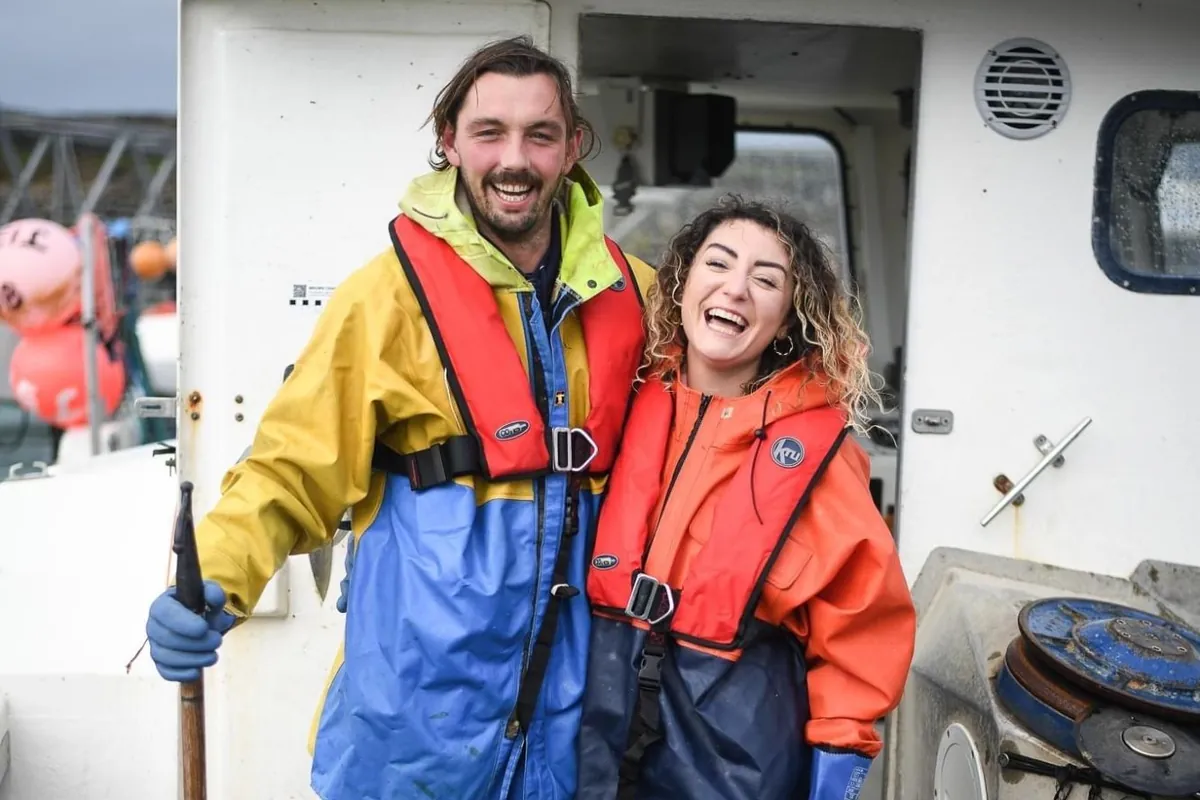 Gabby and Leyton from Jade-S Fisheries laughing on their boat